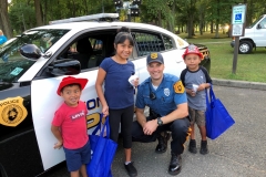 Ofc. Mosakowski showing local children our police car