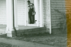 Monroe Police Officer standing outside the old police headquarters