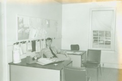 Monroe Police Officer sitting in the old police headquarters