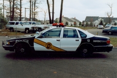 believed to be a mid 90's Chevrolet Caprice in the parking lot of the current Police Station