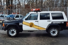 believed to be a mid 90's Jeep Cherokee in the parking lot of the current Police Station
