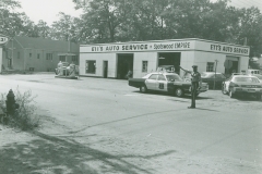 Photo of a Monroe Police Officer directing traffic on the corner of Spotswood Englishtown Road and Harrison Avenue in front of Ett's Auto Service This building is now home to Royal Transmissions
